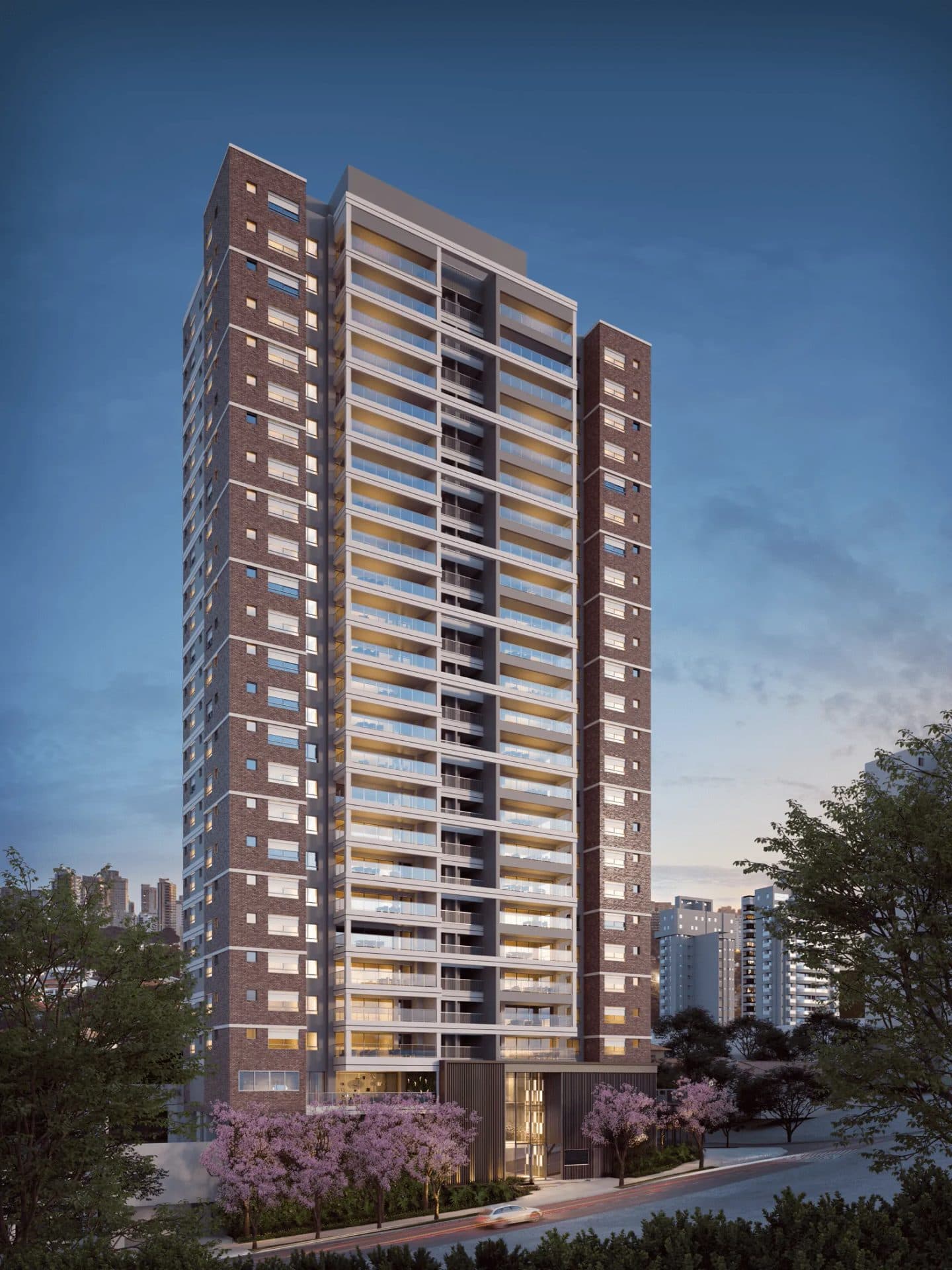 Vista exterior frontal de torre residencial com revestimento de tijolinhos a vista e varandas