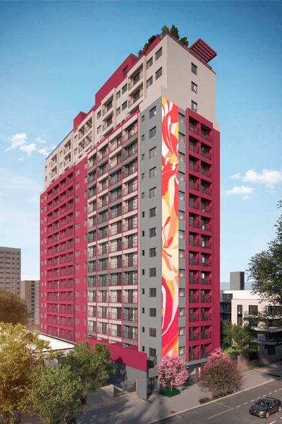 Fachada do edifício residencial com pintura colorida e varandas nos andares.