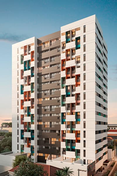 Fachada frontal de prédio residencial com varandas e detalhes em cores variadas